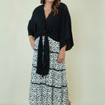 Lucia Leaf Print Tiered Skirt with tie front black top on model 