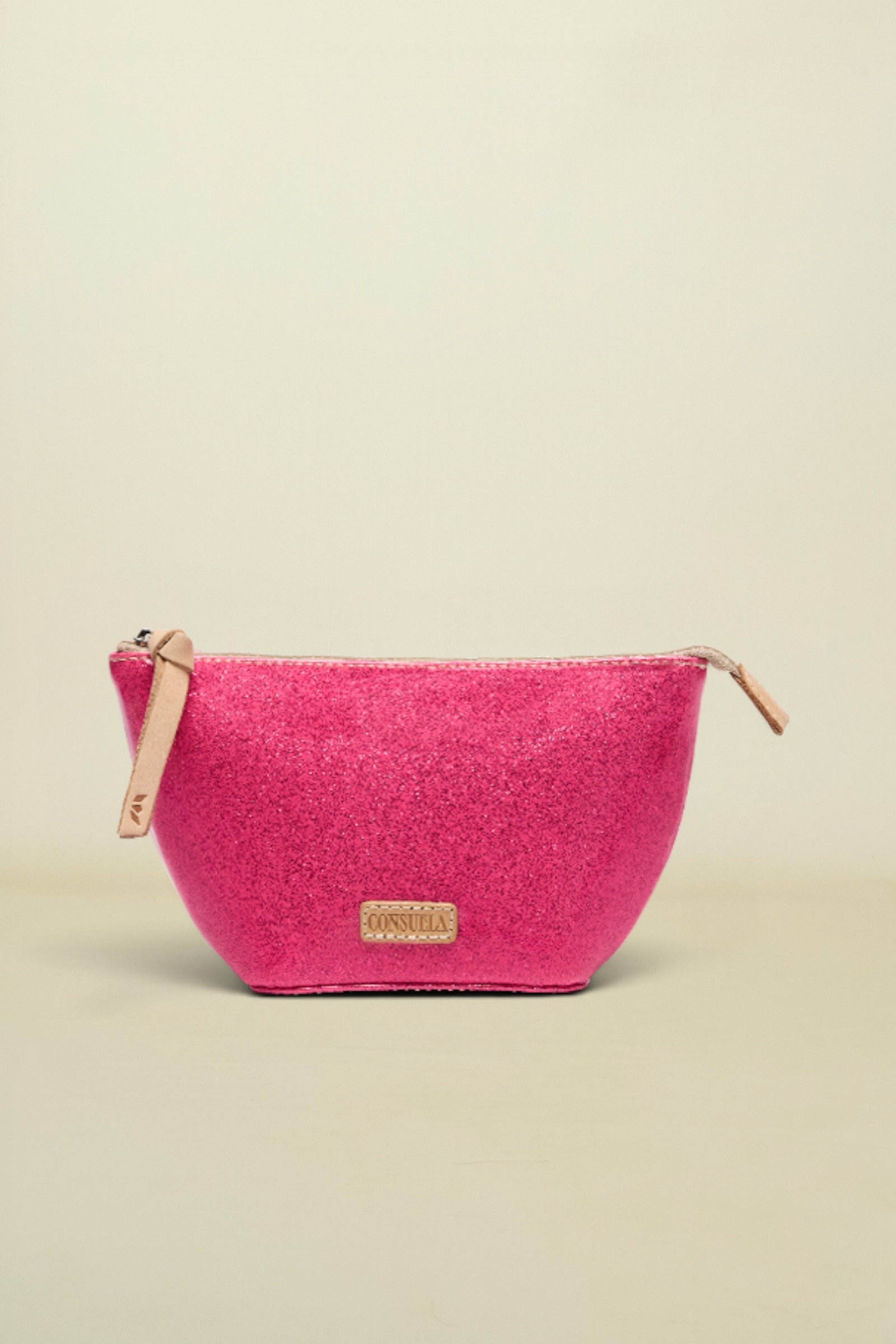 Pink glittery pouch with gold zipper on a white background