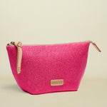 Pink textured pouch with beige zipper and 'Consuela' brand logo on a white background