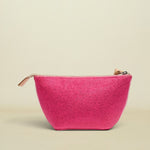 Pink glittery pouch with a gold zipper on a white background