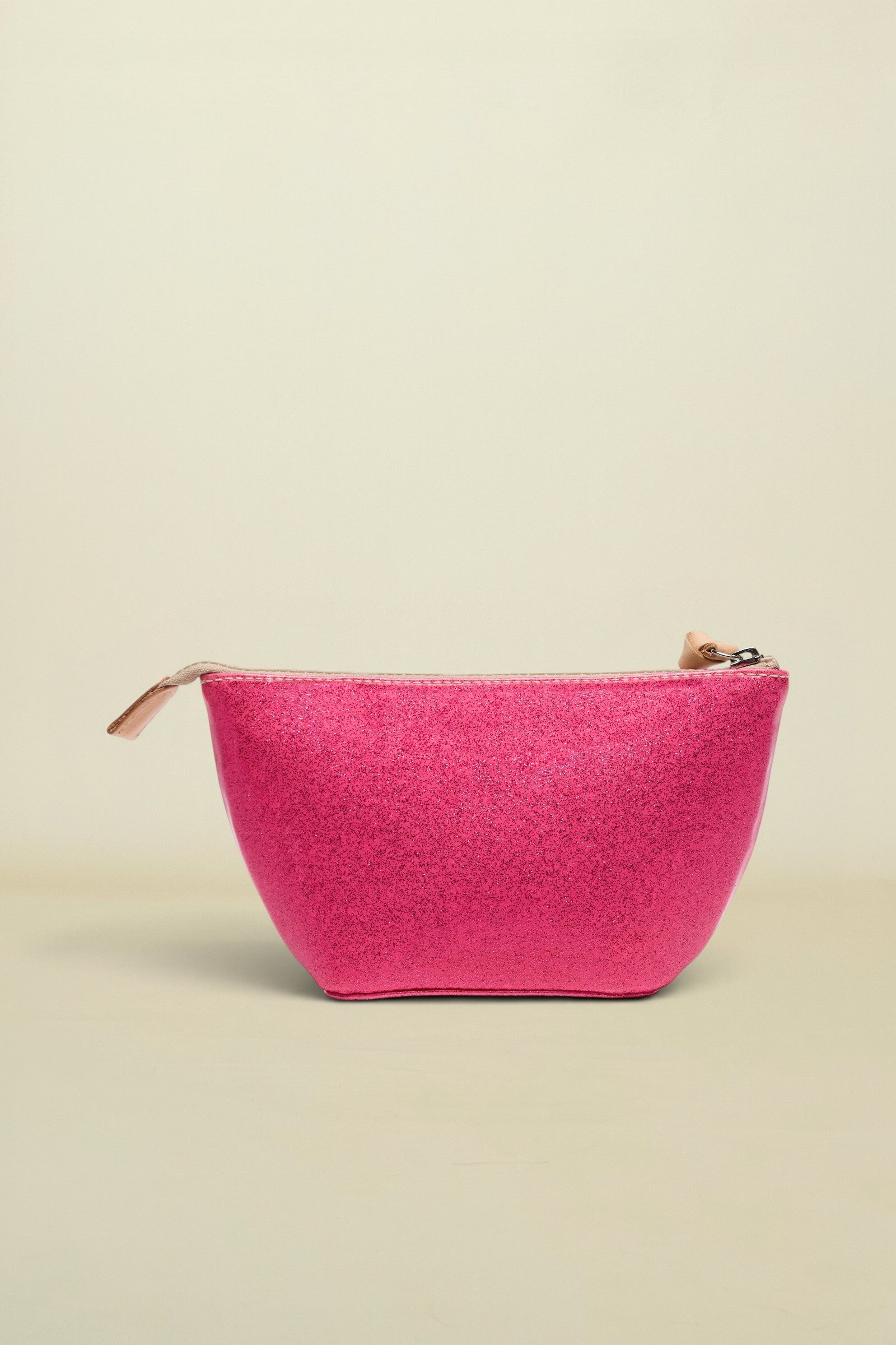 Pink glittery pouch with a gold zipper on a white background