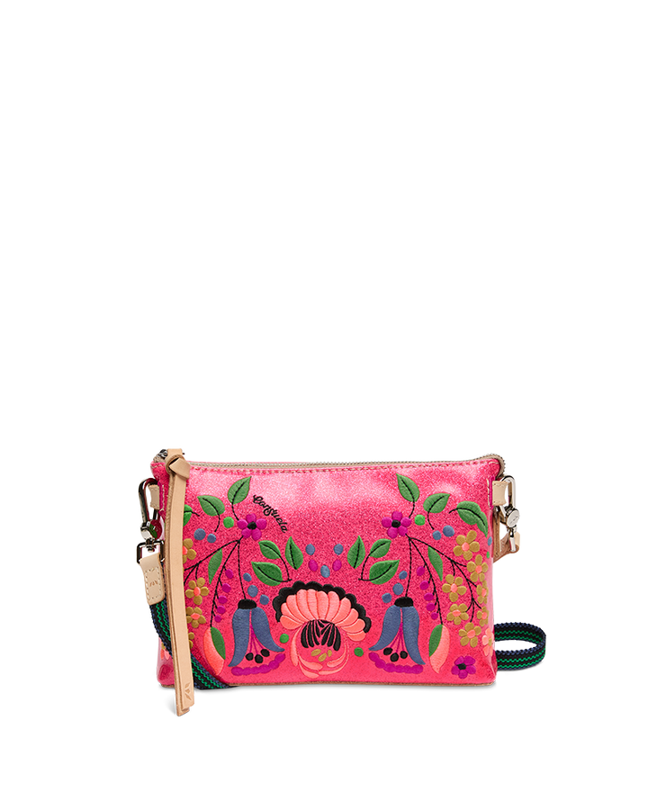 Pink handbag with floral and ethnic designs on a white background