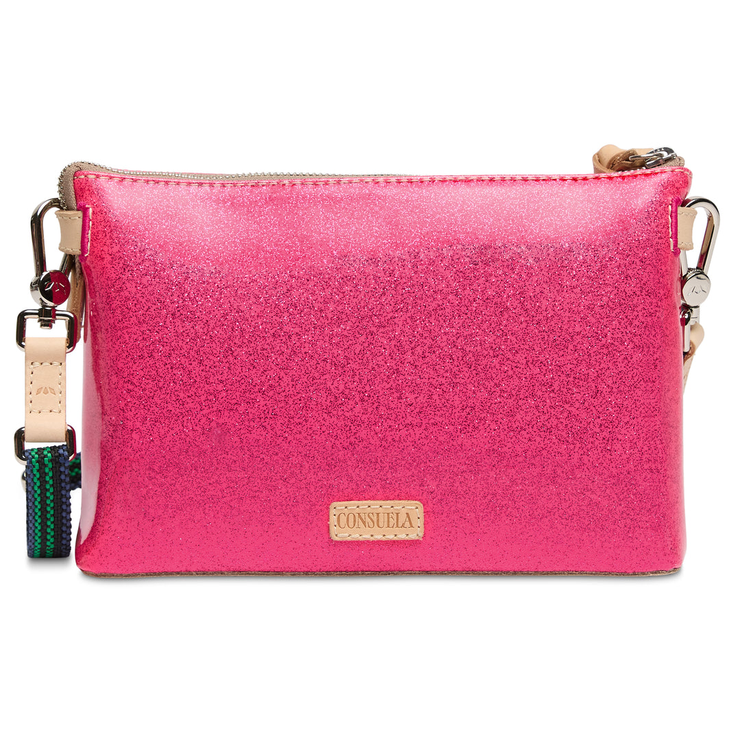 Pink crossbody bag with a visible brand logo on a white background