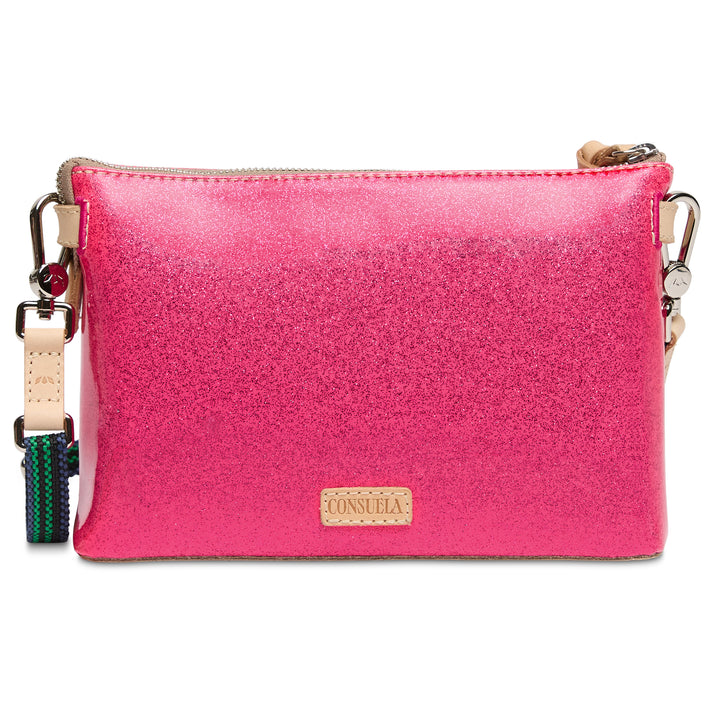 Pink crossbody bag with a visible brand logo on a white background