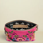 Pink floral handbag with a visible brand label on a white background