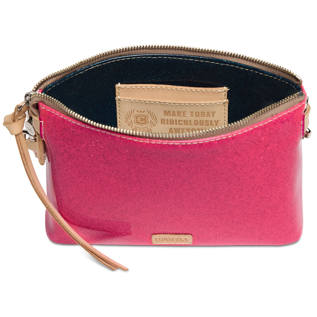 Pink clutch bag with beige strap and visible brand logo on a white background