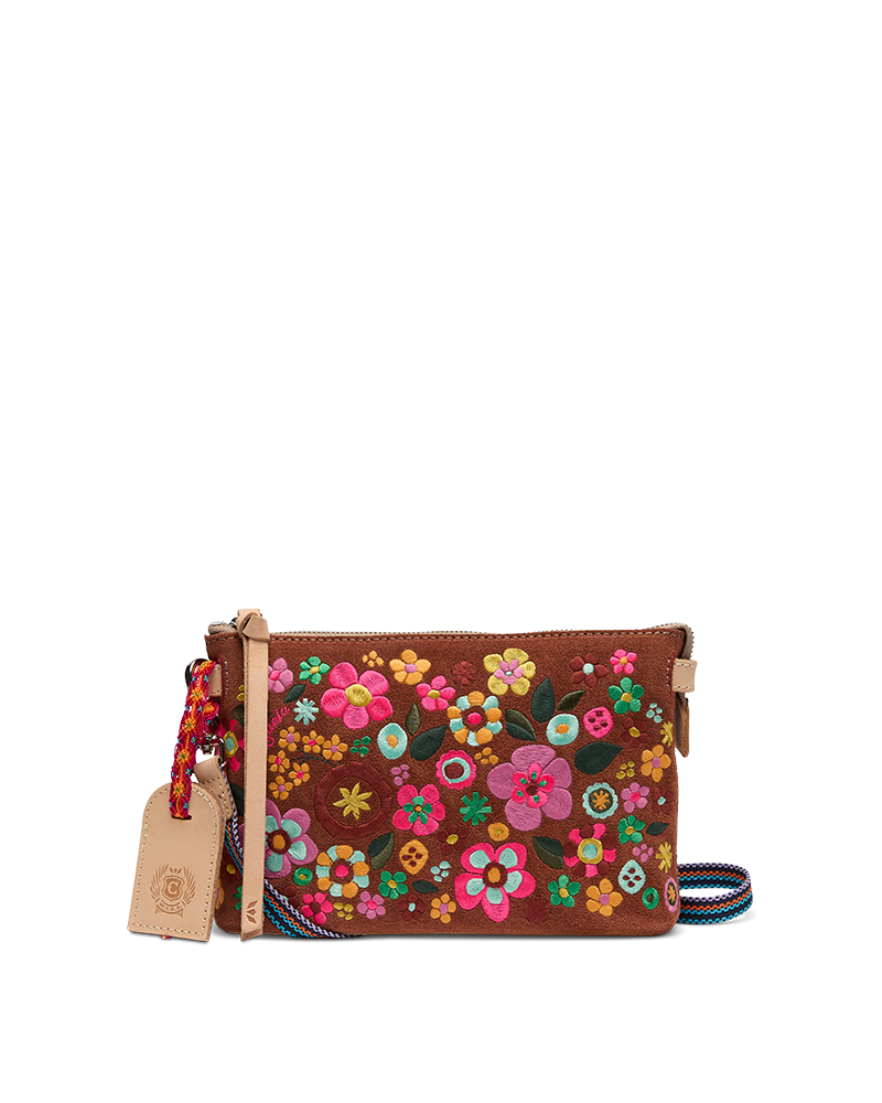 Floral-patterned crossbody bag with a visible brand tag on a white background