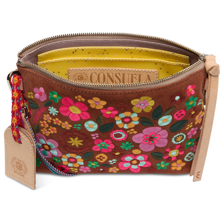 Floral-patterned handbag with visible brand name on a white background