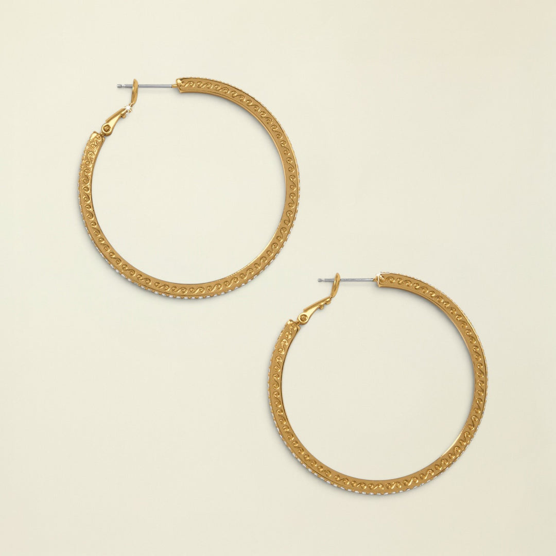 Gold hoop earrings on a white background