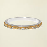 Gold and silver bracelet with gemstones on a white background