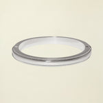 Silver metal ring on a white background