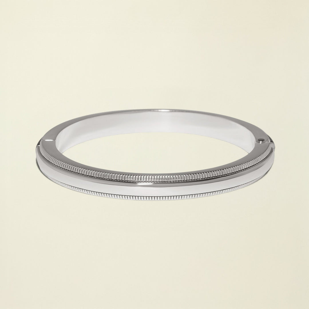 Silver metal ring on a white background