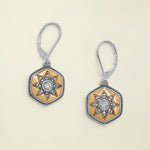 Pair of earrings with star design on a white background
