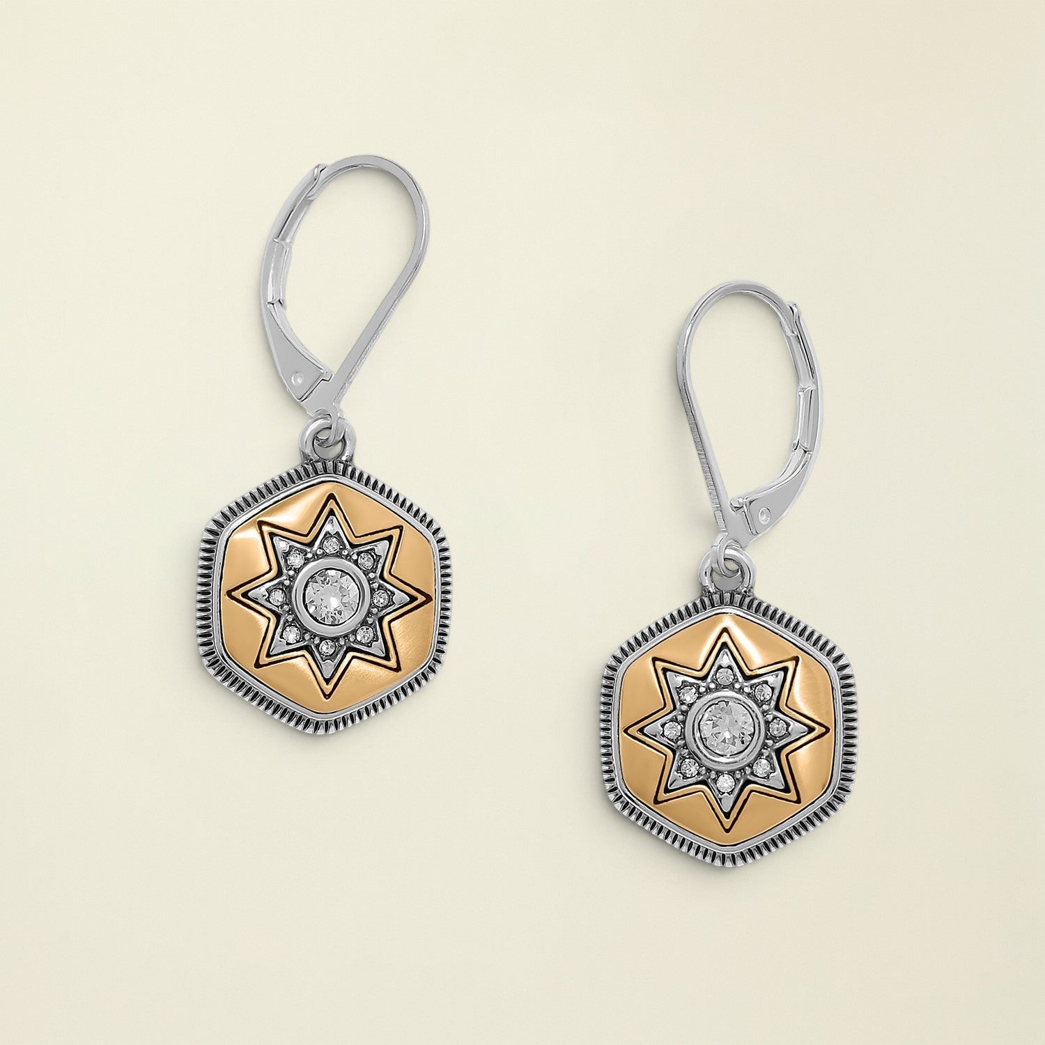 Pair of earrings with star design on a white background