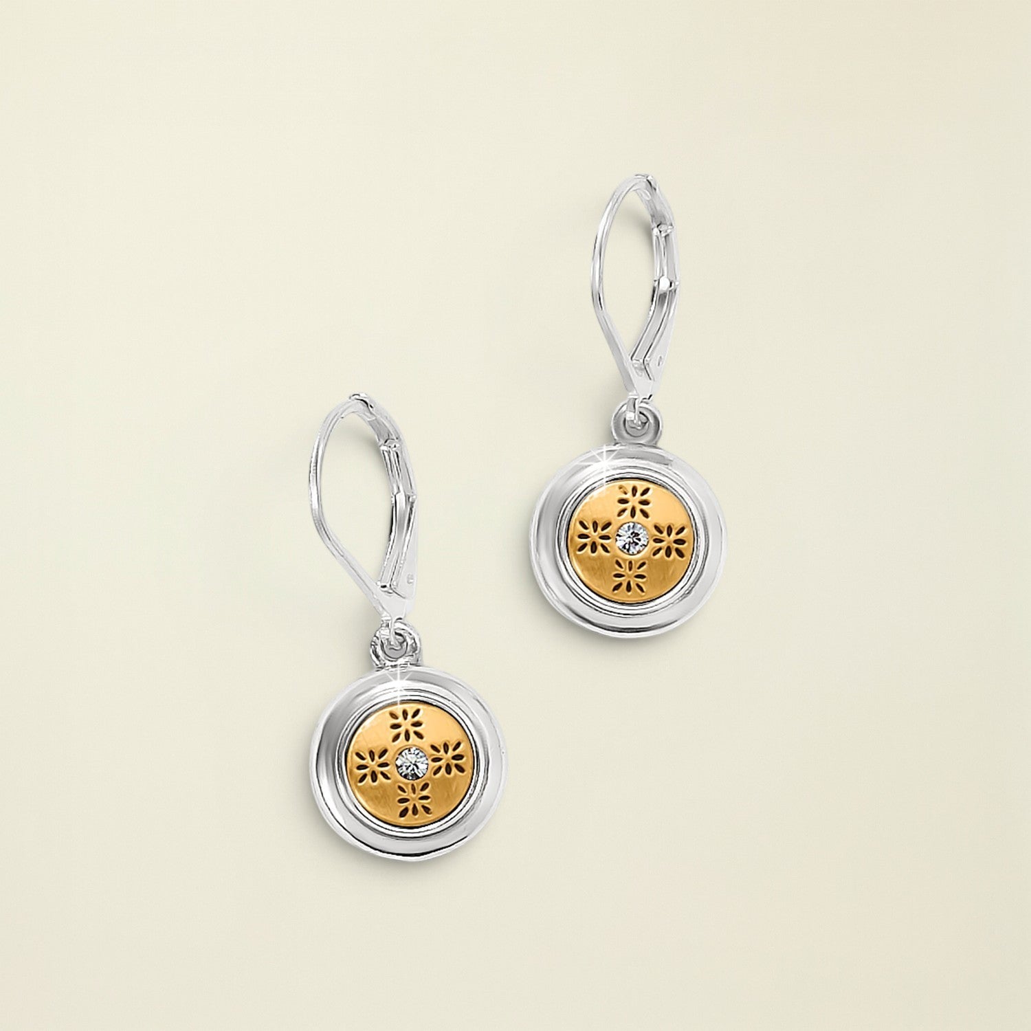 Pair of earrings with gold and silver design on a white background