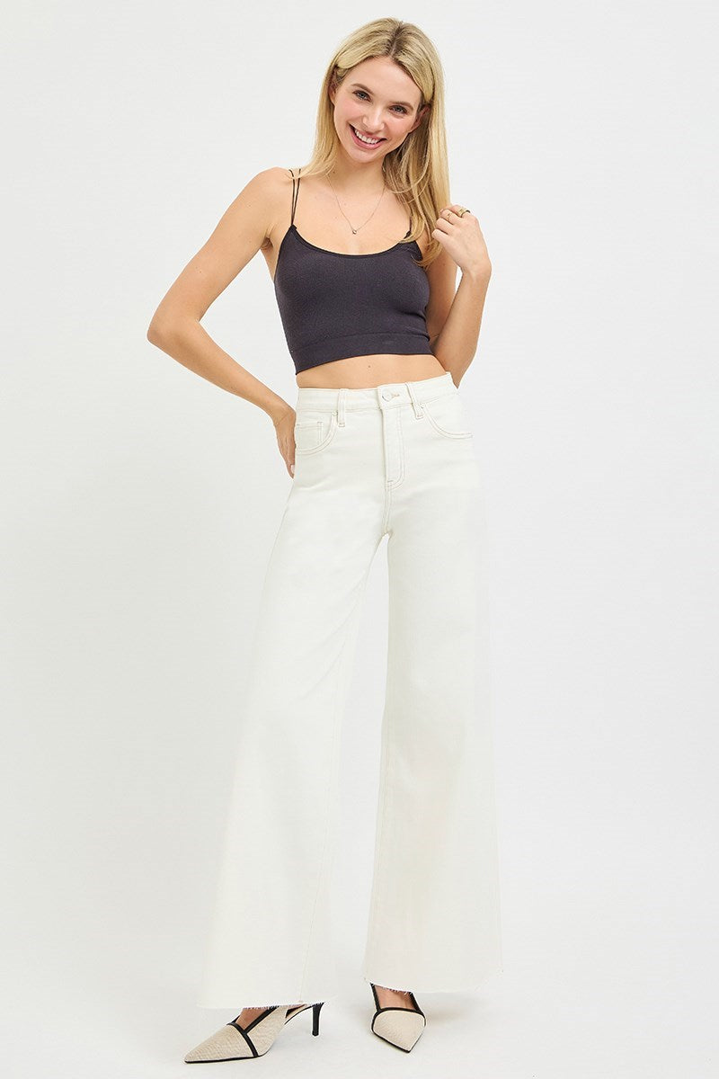 woman wearing black tank and Risen Cream Wide Leg Jeans