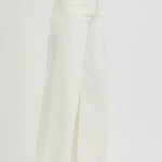 side view of woman wearing Risen Cream Wide Leg Jeans