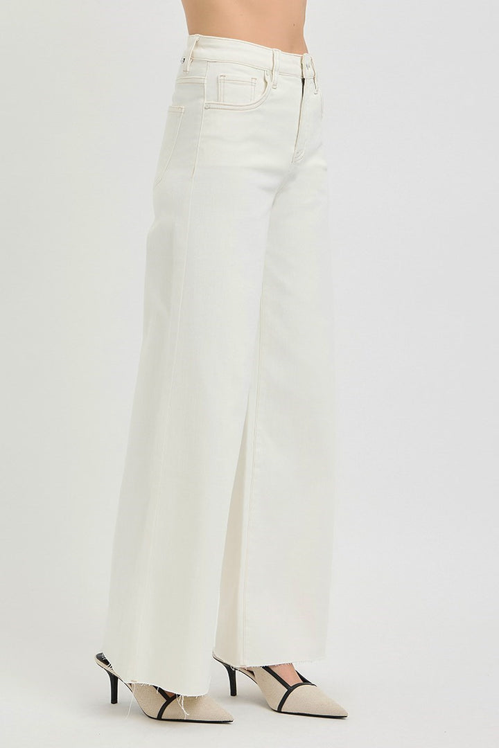 side view of woman wearing Risen Cream Wide Leg Jeans