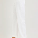 side view of woman wearing Risen White Mid Rise Ankle Barrel Jean