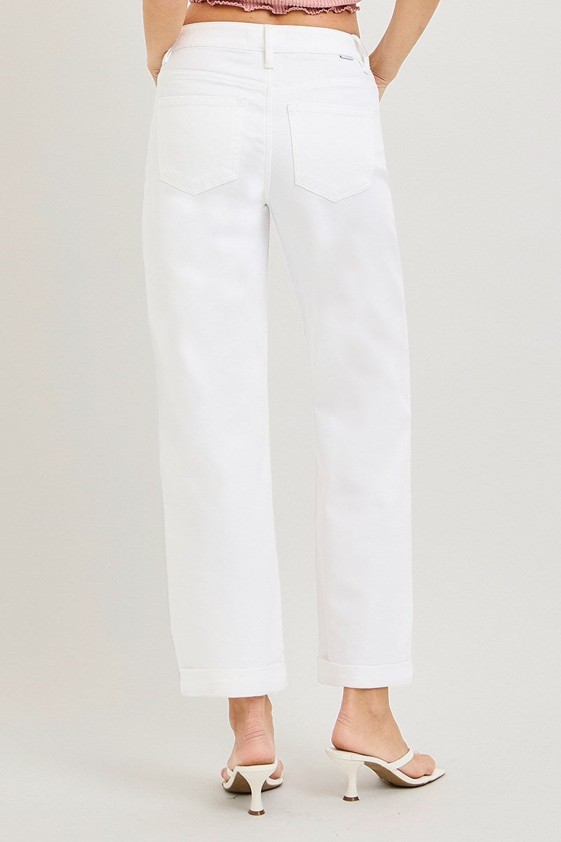 White pants worn by a person on a white background