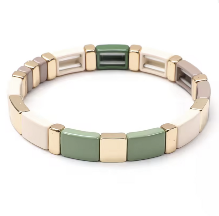 Bracelet with gold and silver rectangular links on a white background