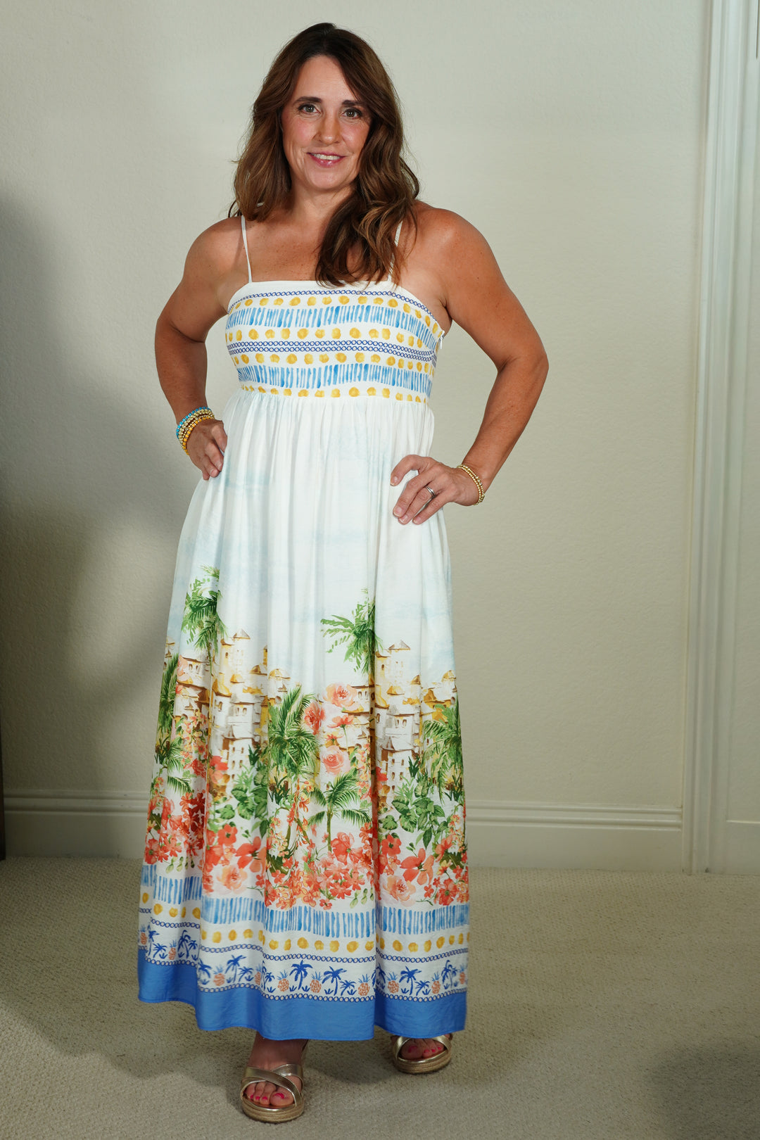 Woman wearing a floral dress with a white background