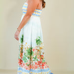 Woman wearing a floral dress with a white background