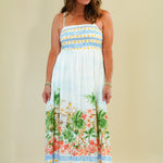 Woman wearing a floral dress with a beige background