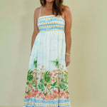 Woman wearing a floral dress with a white background
