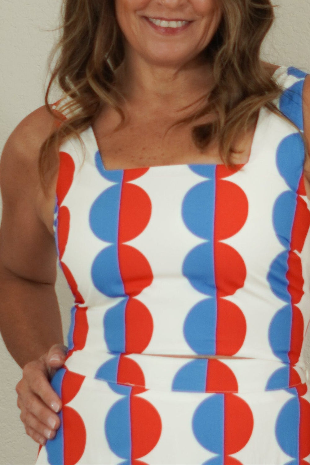 close up of women wearing red and blue geo print tank 