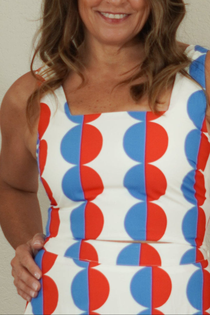 close up of women wearing red and blue geo print tank 