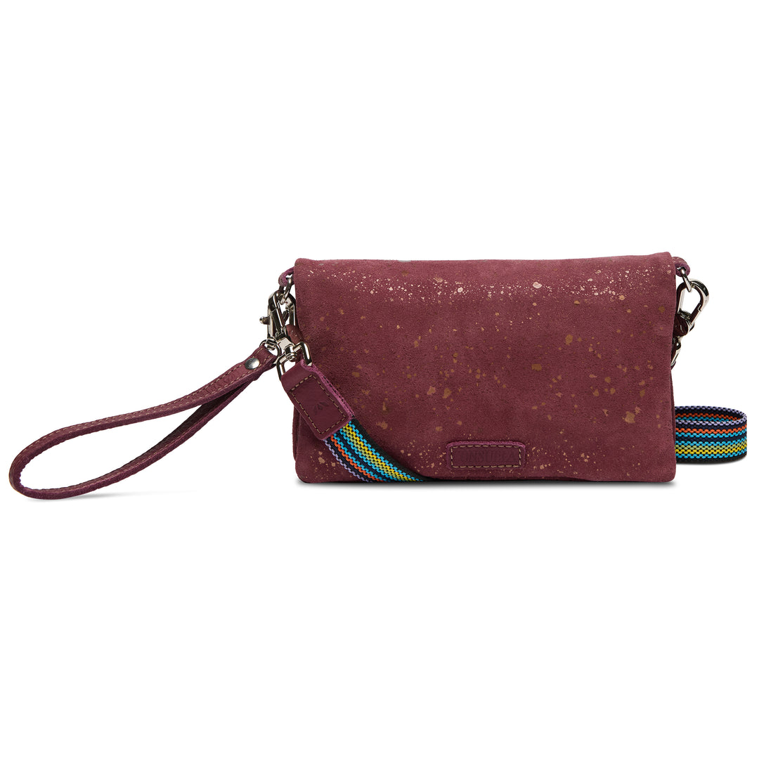 Maroon cork wallet with a colorful strap on a white background