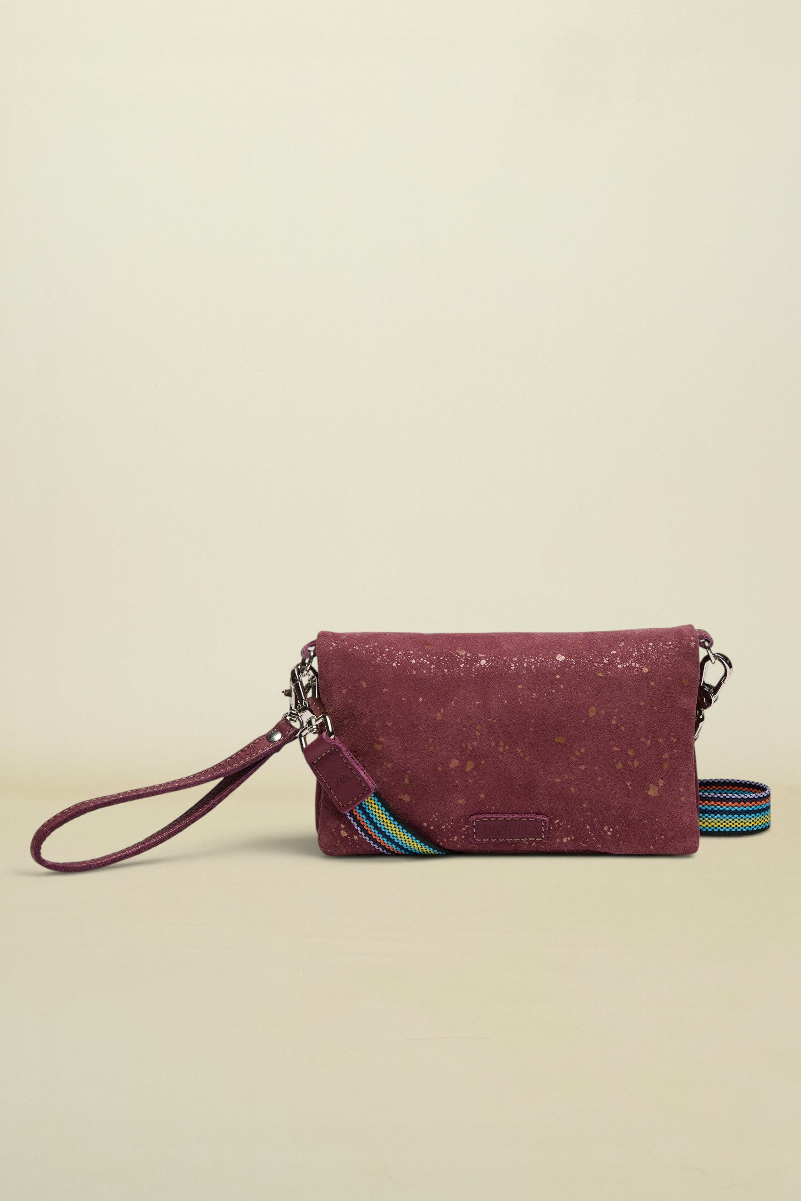 Maroon cork wallet with a colorful strap on a white background