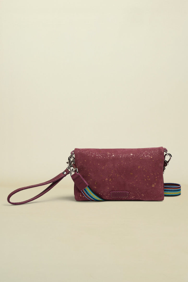 Maroon cork wallet with a colorful strap on a white background