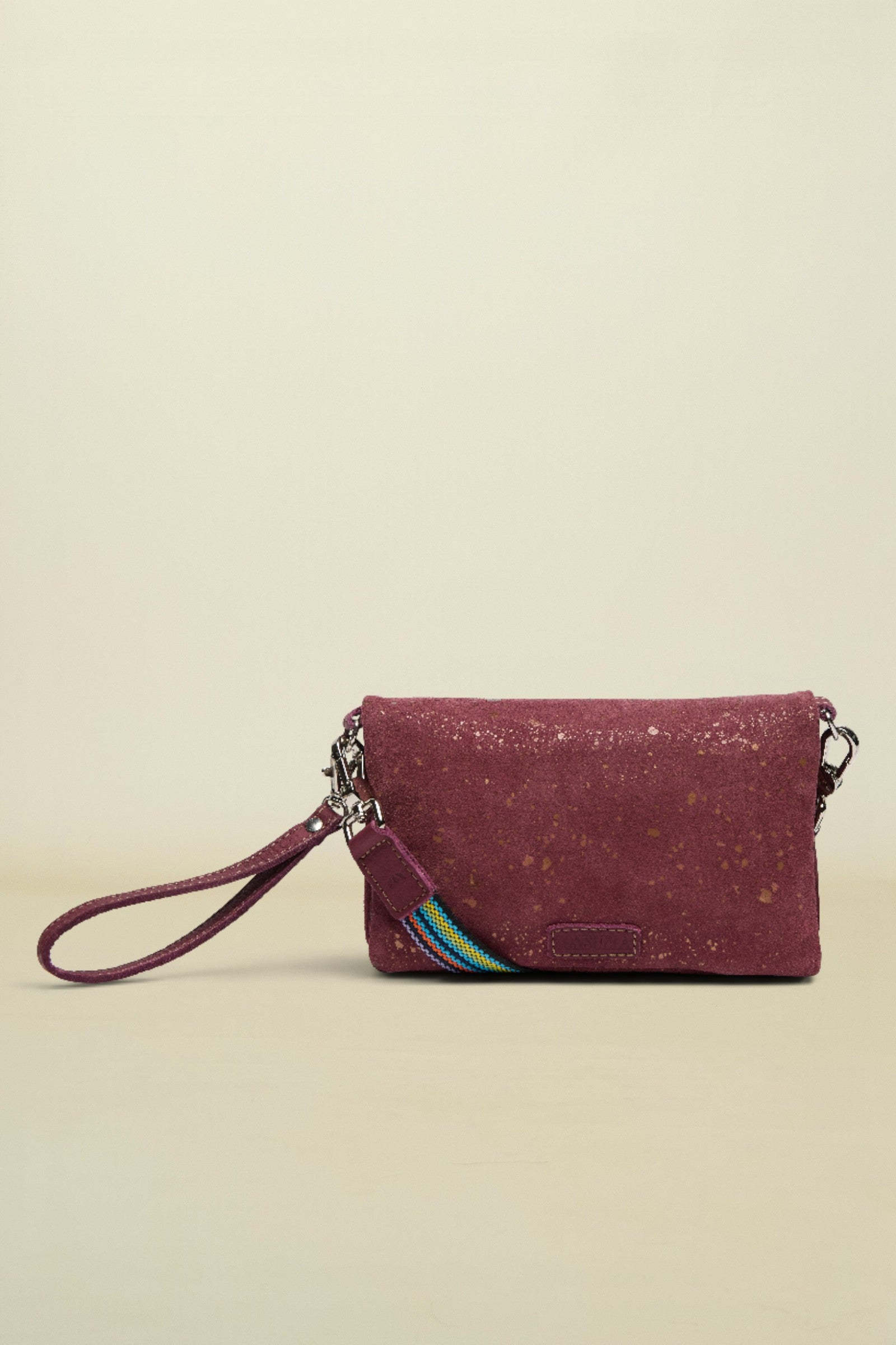 Maroon cork wallet with a strap on a white background