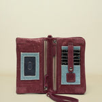 Maroon wallet with blue accents on a white background