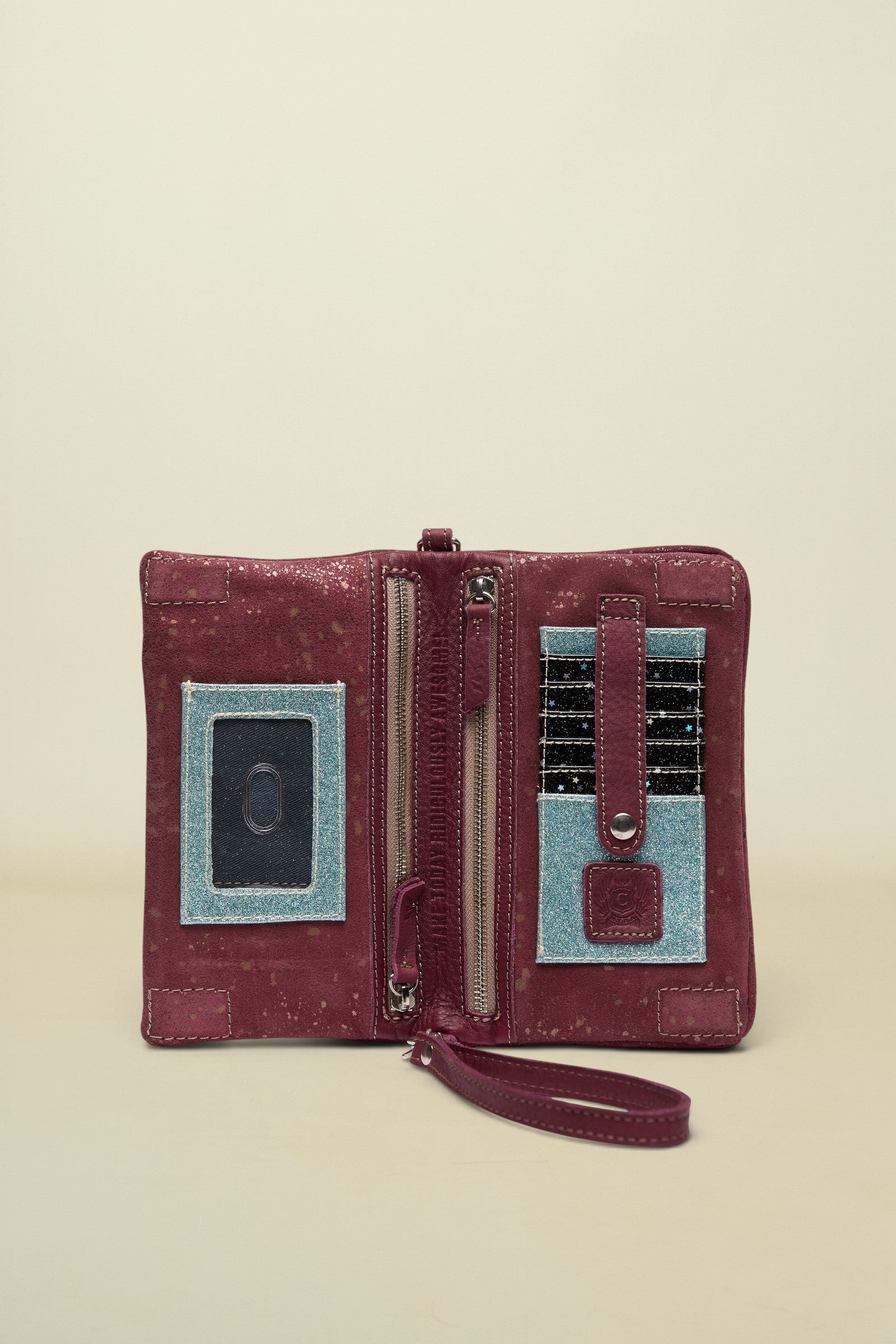 Maroon wallet with blue accents on a white background