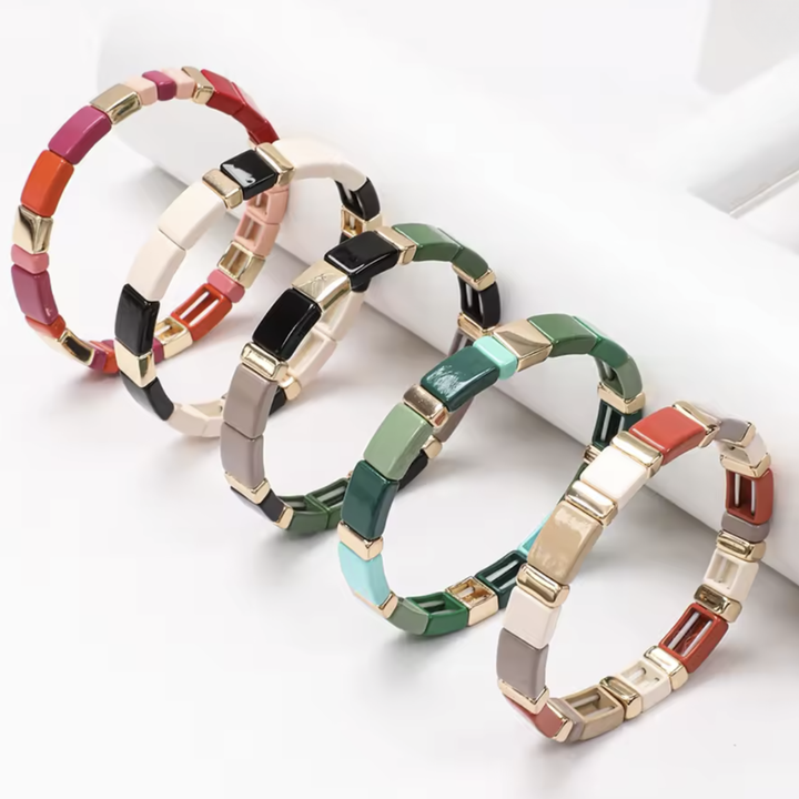 Colorful bracelets with geometric design on a white background