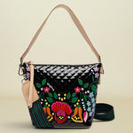 Handbag with floral embroidery on a white background