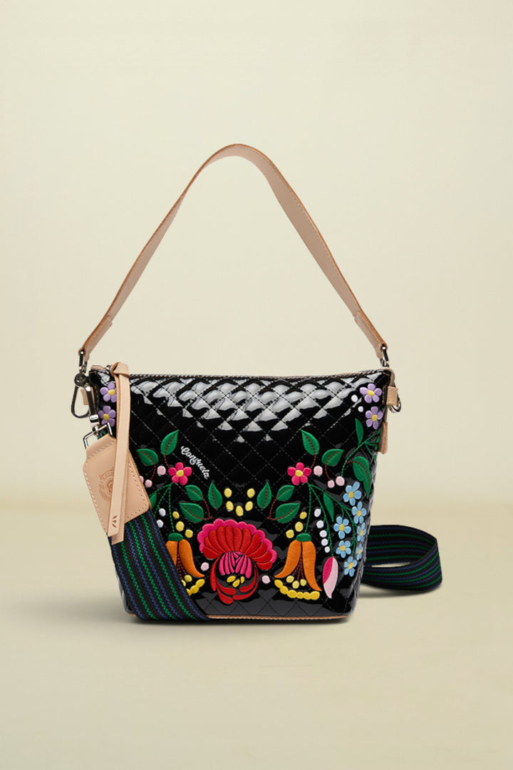 Handbag with floral embroidery on a white background