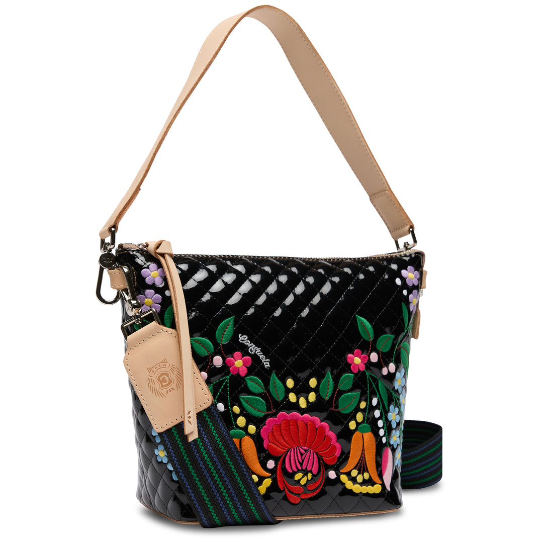 Colorful handbag with floral embroidery on a white background