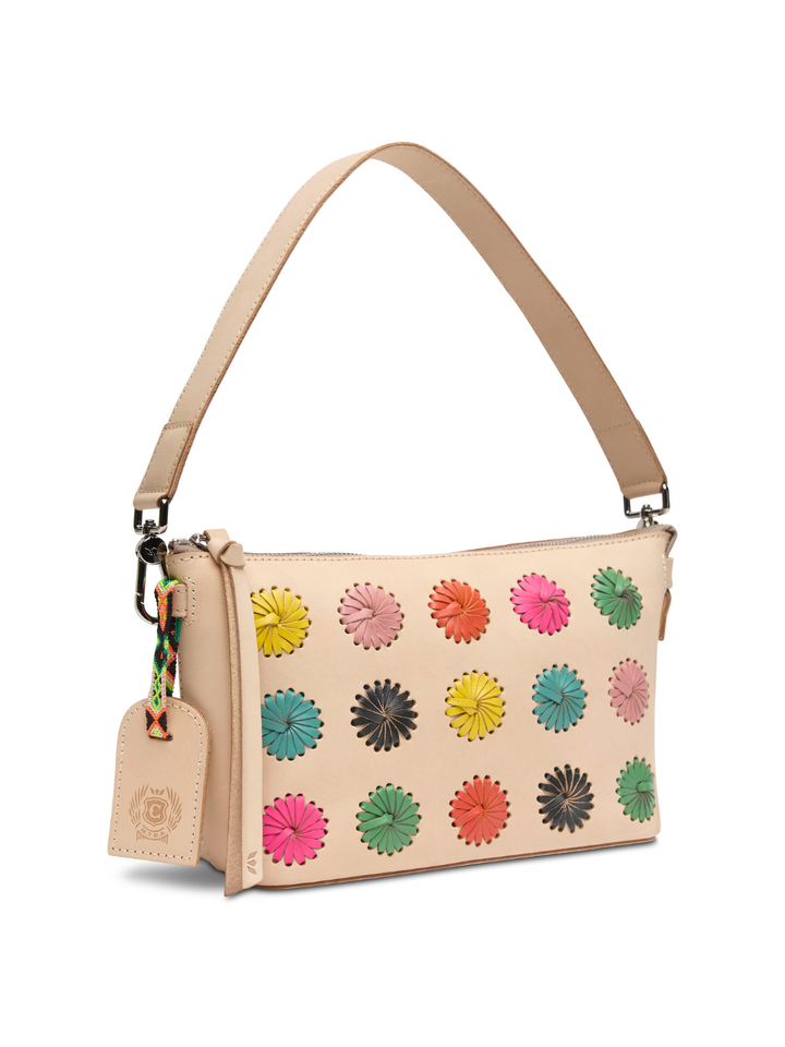 Beige handbag with colorful floral patterns on a white background