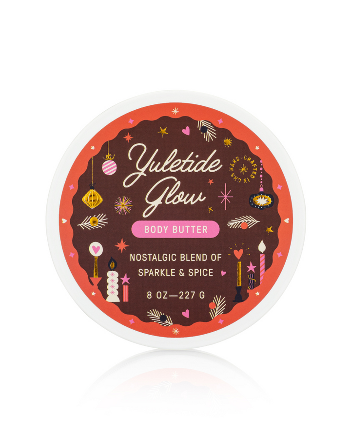 Yuletide Flow body butter container with decorative label on a white background