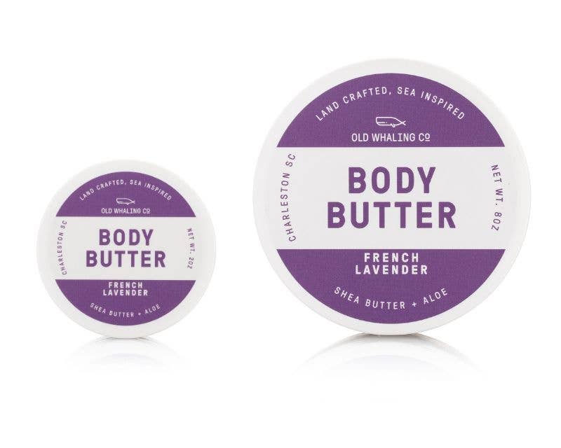 Two containers of Old Whaling Co. body butter with purple labels on a white background