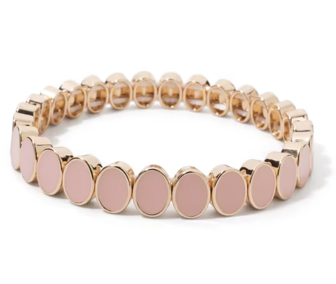 Bracelet with pink circular charms on a white background