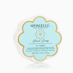 A Spongelle product packaging with a floral design and the brand name, showcasing the Beach Grass Daisy Spongelle with a pale blue background.