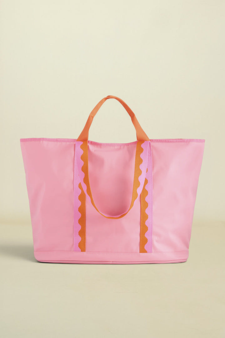 Pink tote bag with orange handles and decorative elements on a white background