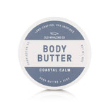 Body butter container with blue label on a white background