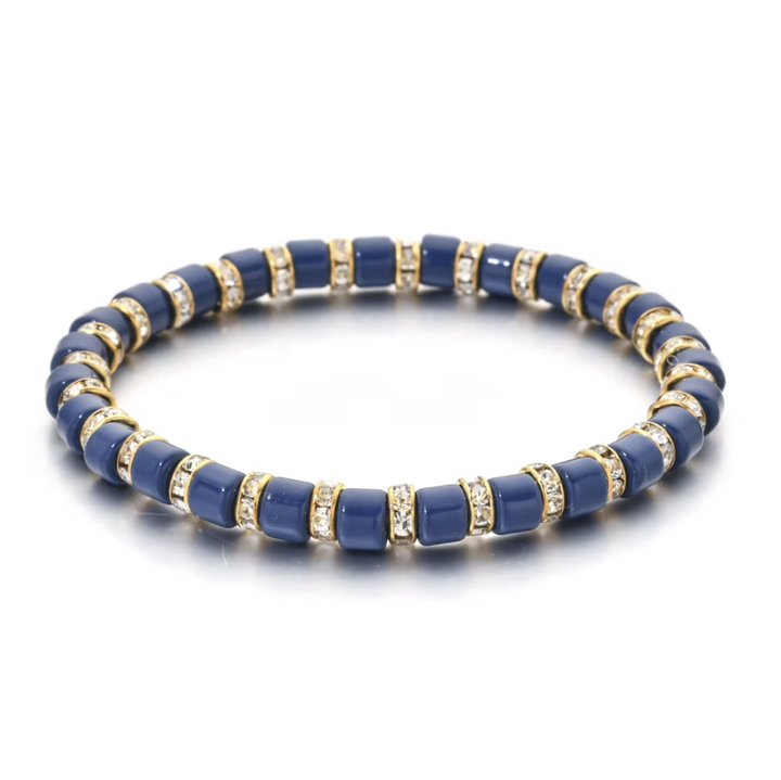 Blue beaded bracelet with gold accents on a white background