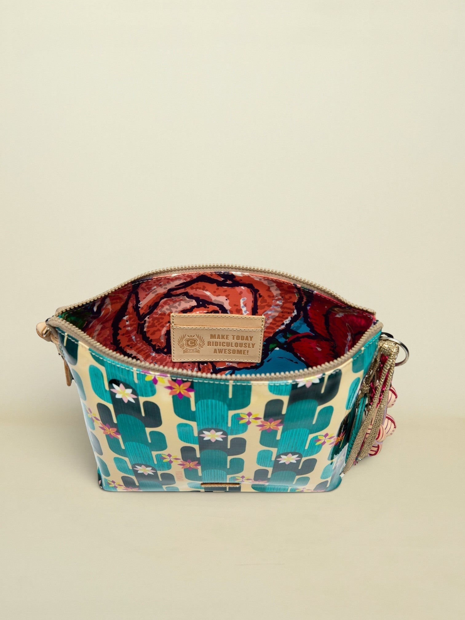 Point of Origin CONSUELA Desi Downtown crossbody bag with cactus print, interior floral lining, and inspirational leather patch.
